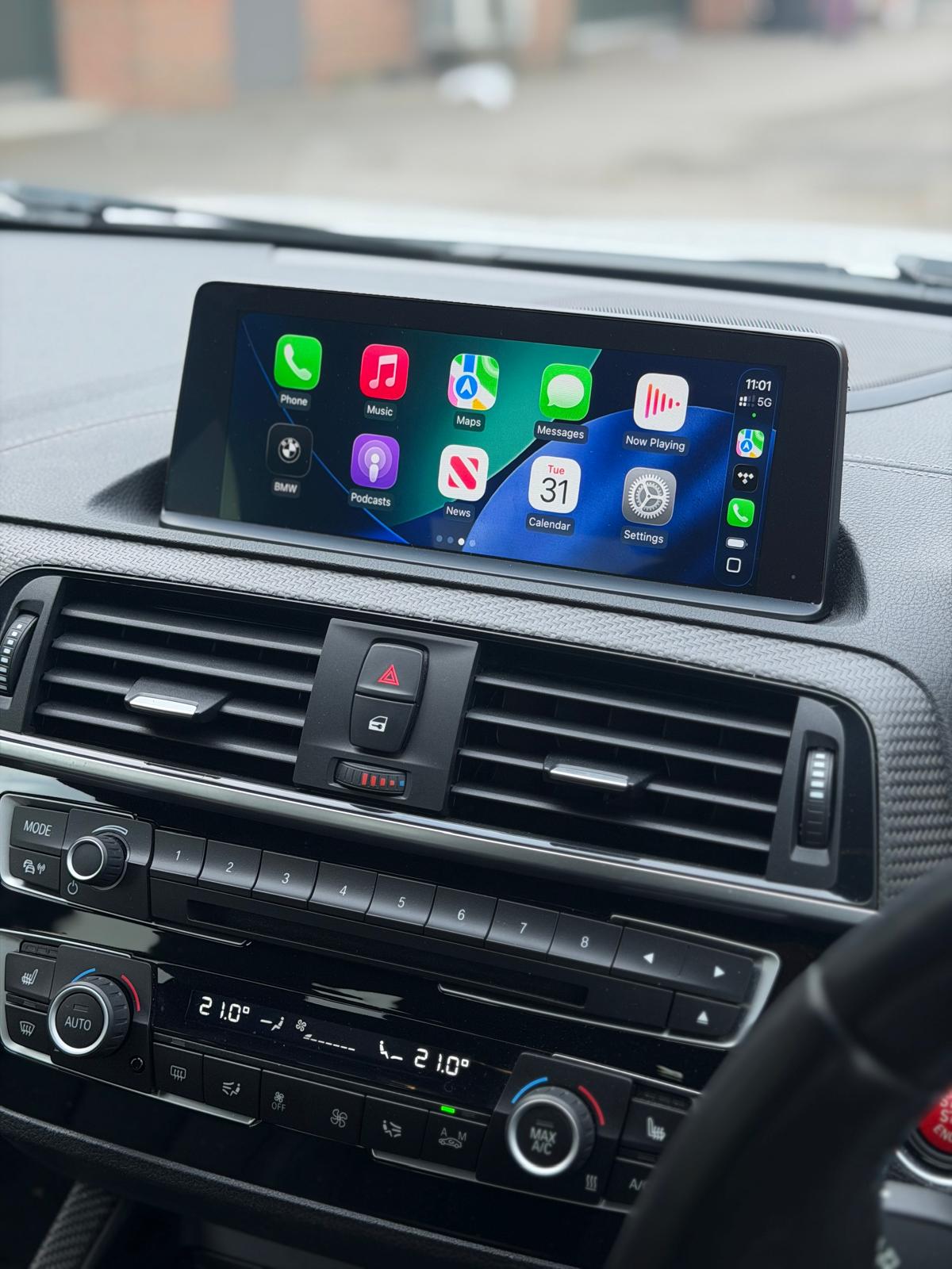 Apple CarPlay running on a BMW's factory screen after retrofit