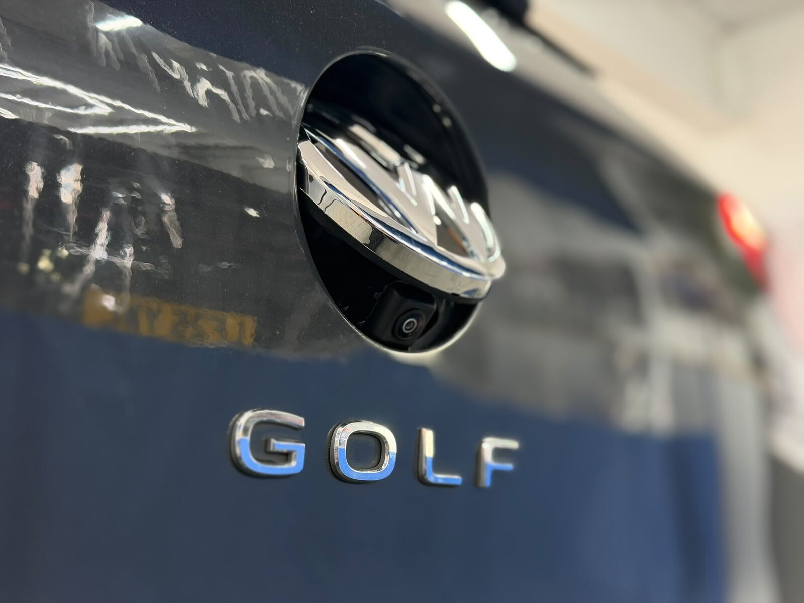 Reversing camera fitted into the flip-up VW badge on a Golf's tailgate