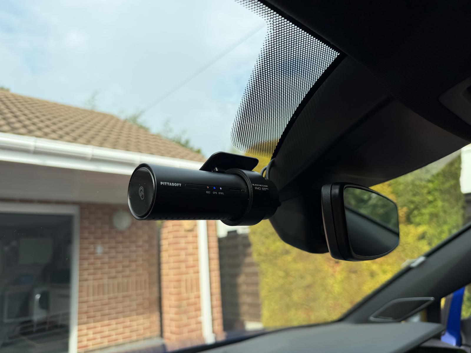 BlackVue DR770X cloud dash camera fitted tight beside the mirror on a windscreen