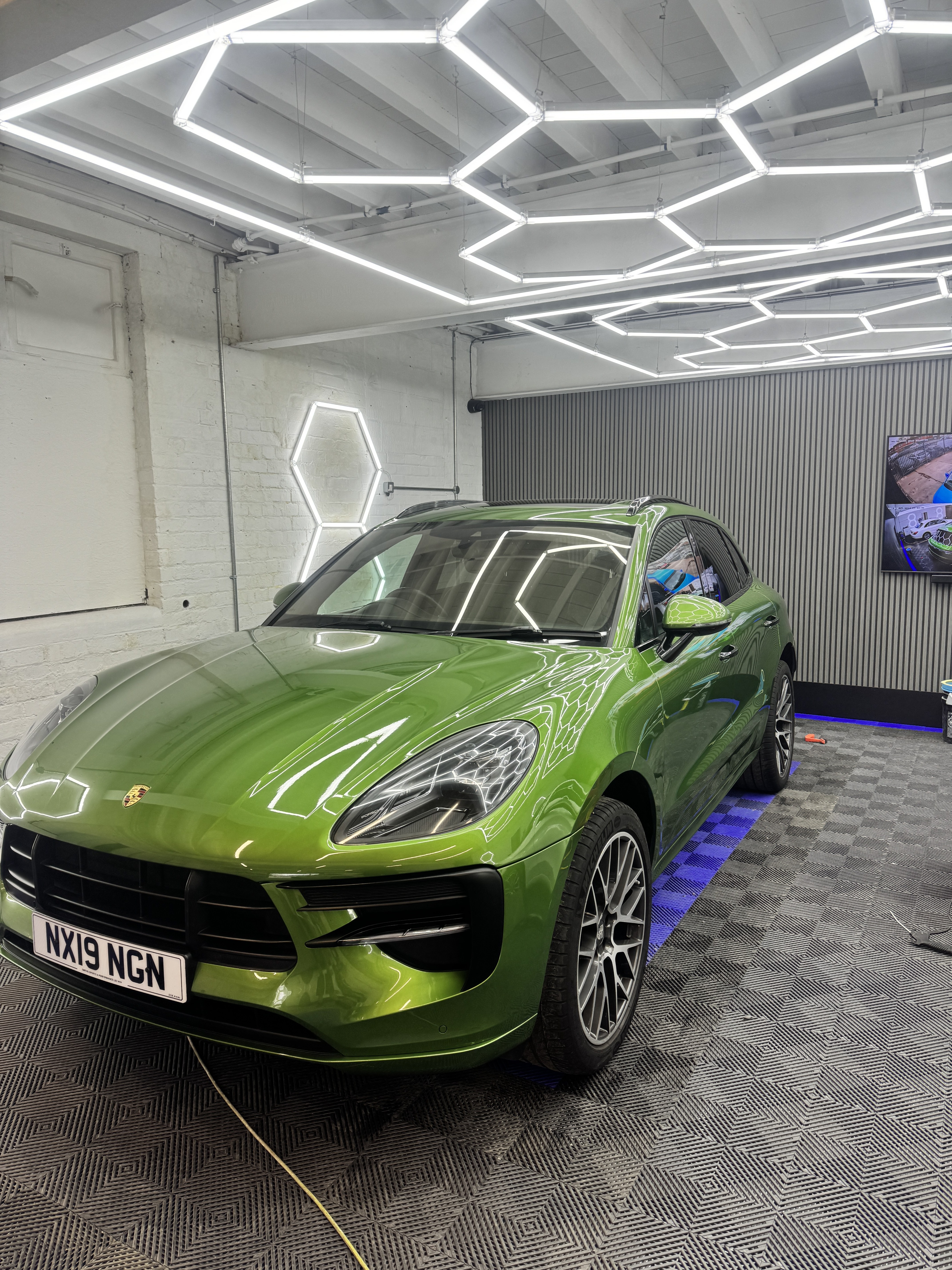 Porsche in the detailing bay for a maintenance valet