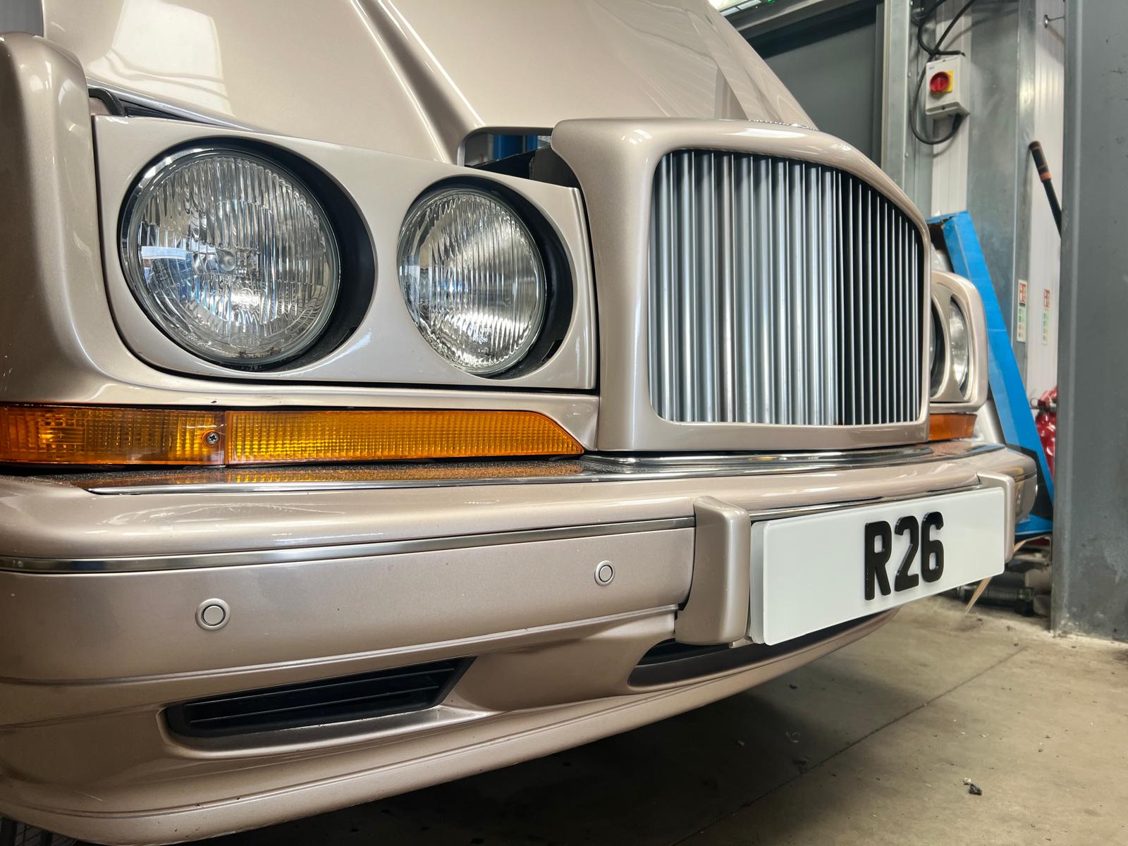 Colour-matched parking sensors fitted into a Bentley's front bumper
