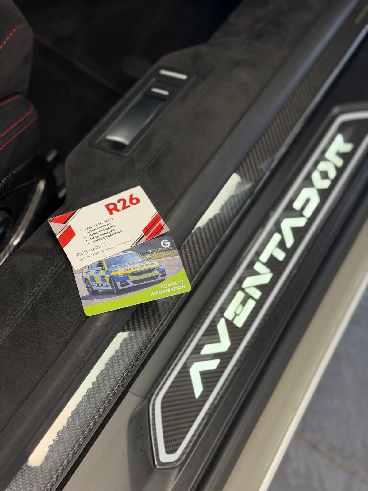 SmarTrack monitoring contact card handed over in a Lamborghini after tracker fitting