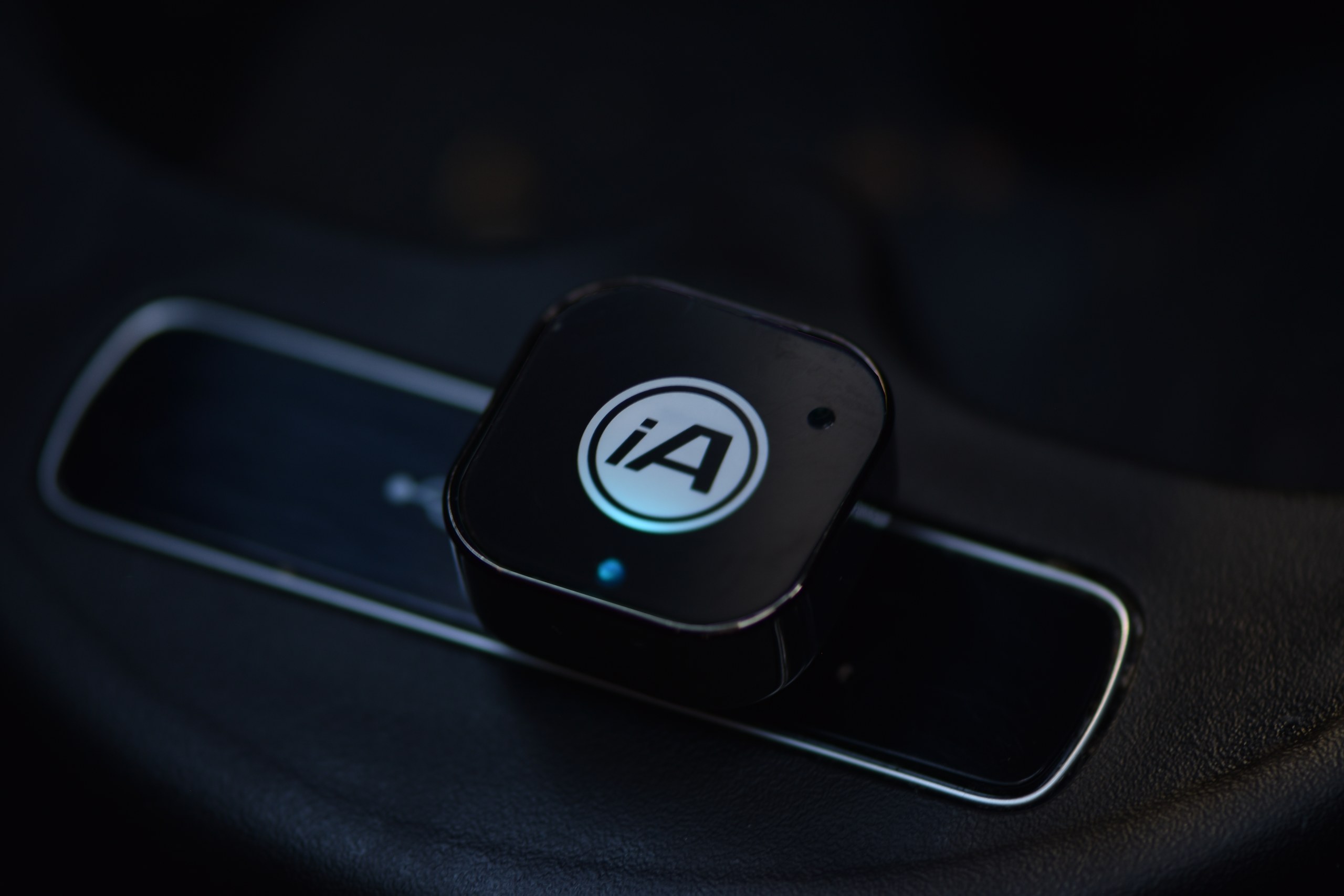 Wired-to-wireless CarPlay adapter plugged into a car's USB port